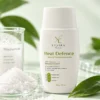 Heat Defence Mineral Hybrid Sunscreen photographed with its key ingredients