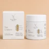 Tan Undone Face Scrub bottle beside its carton