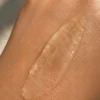 Tan Undone Face Scrub texture swatched on skin