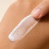 Unseen Barrier Repair Sunscreen texture swatched on skin